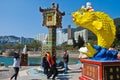 REPULSE BAY, HONG KONG Ã¢â¬â MARCH 02, 2016: People toss a coin into the fish`s mouth the believe it good luck. MARCH 02, 2016